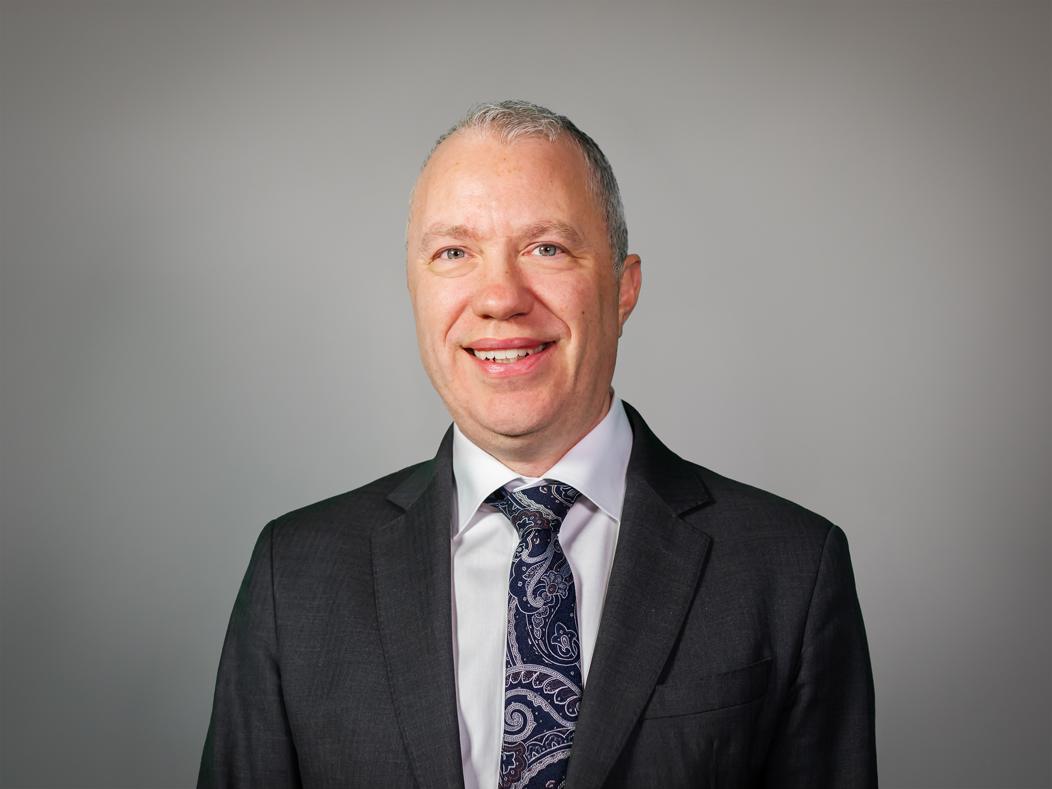 Management Team Member 1